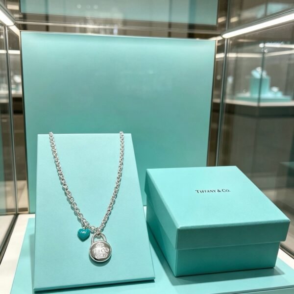 Tiffany & Co. Silver Padlock and Turquoise Heart Charm Necklace